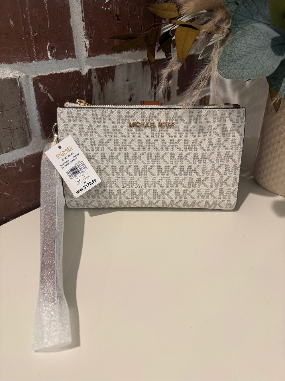 Michael Kors Beige/White MK Logo Wristlet with Gold Hardware. NWT.